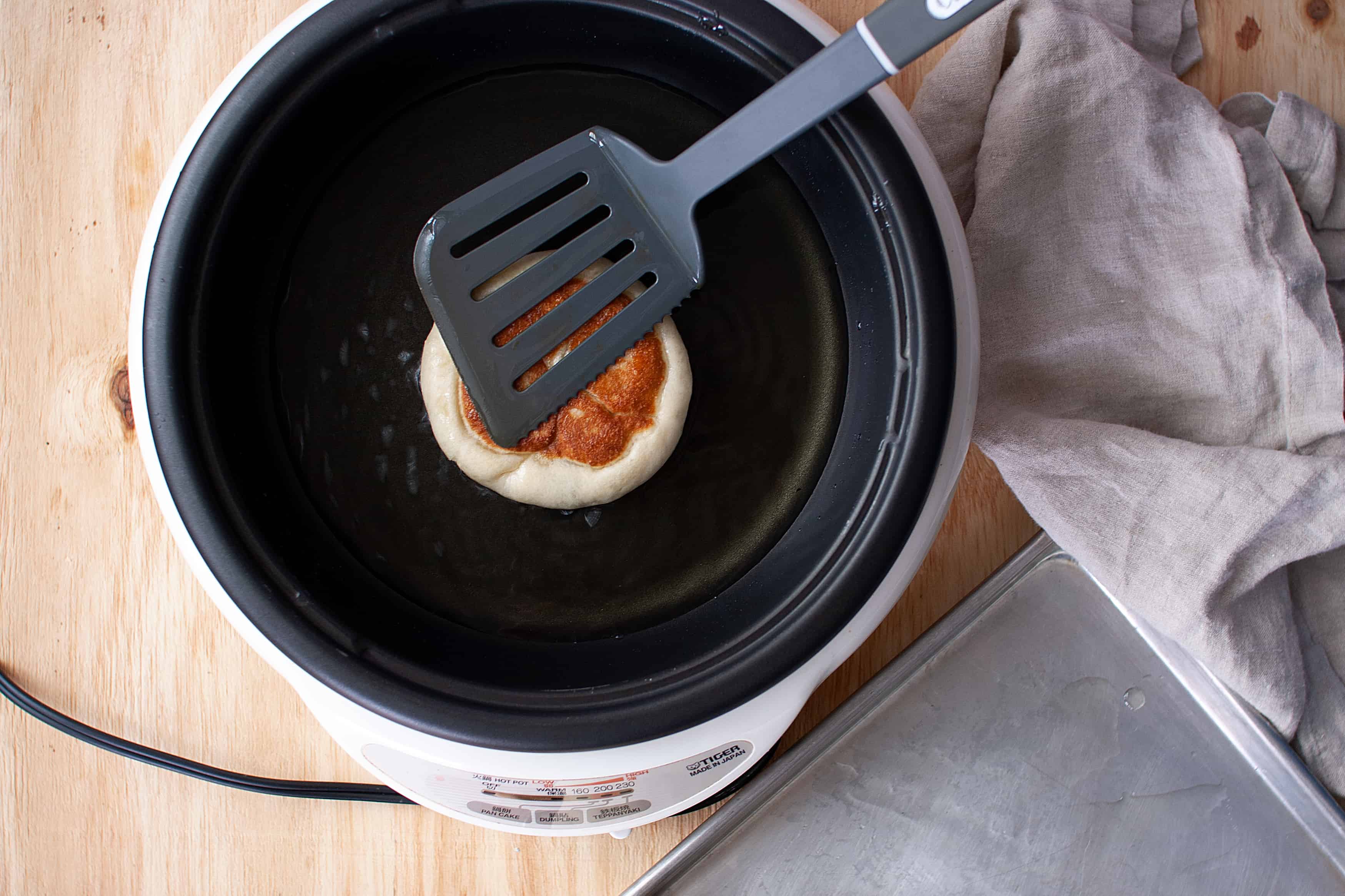 How to fry hotteok, sweet Korean pancakes. 